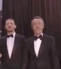 Two Men in Tuxedos Standing