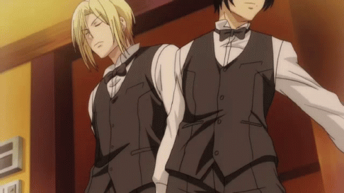 Two Men In Tuxedos Standing Together GIF