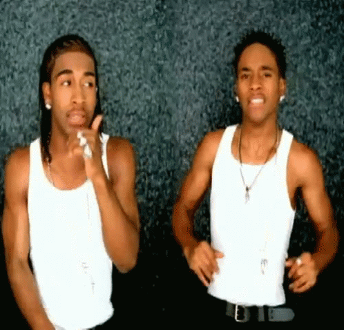 Two Men In White Tank Tops And Black Pants GIF