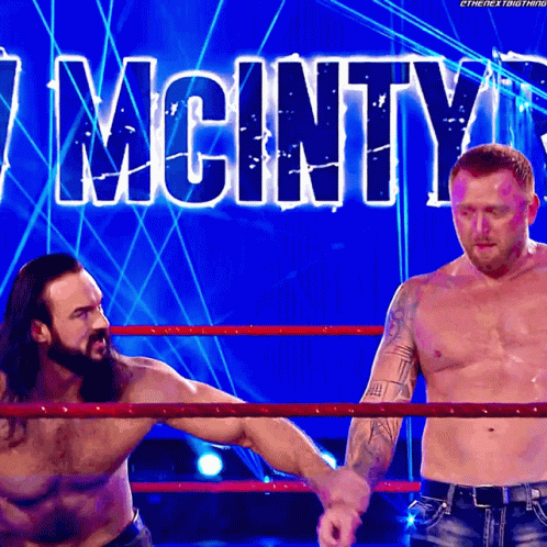 Two Men in Wrestling Ring With Mcinty