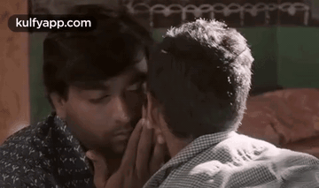 Two Men Kiss On Cheek GIF