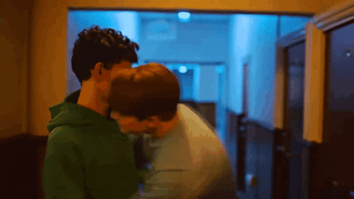 Two Men Kissing in Hallway