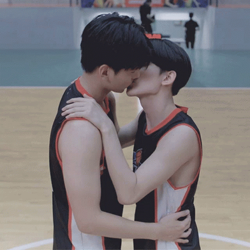 Two Men Kissing on Basketball Court