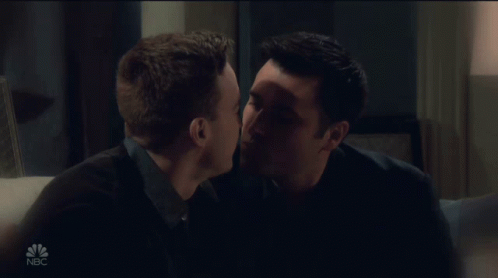 Two Men Kissing On Couch With NBC GIF