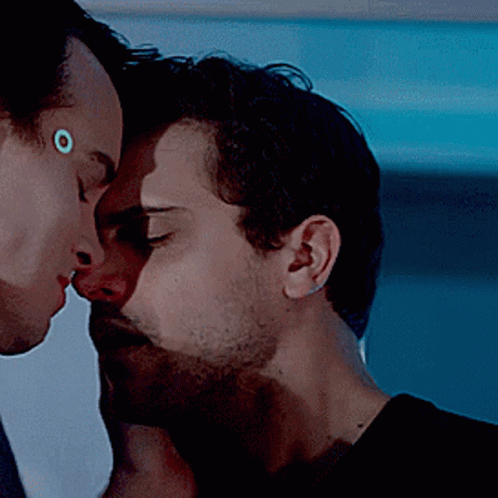 Two Men Kissing with Circle on Forehead