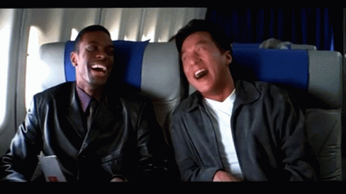Two Men Laughing on Airplane