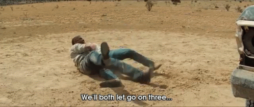 two men laying on the ground with the words we 'll both let go on three