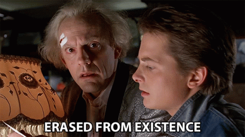 Two Men Looking At A Lamp With The Words " Erased From Existence " Above Them GIF