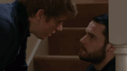 Two Men Looking at Each Other