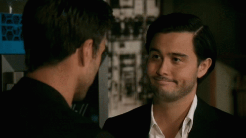 Two Men Looking At Each Other One With Beard GIF