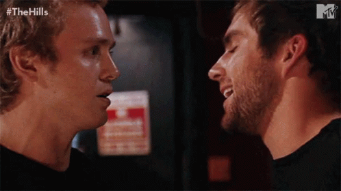 Two Men Looking at Each Other