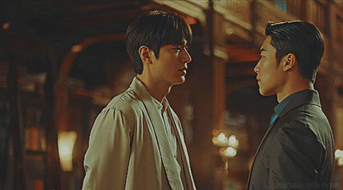 Two Men Looking at Each Other Saying Don't