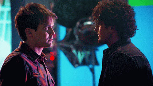 Two Men Looking at Each Other with Balloon