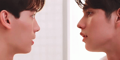 Two Men Looking At Each Other With Mouths Open GIF