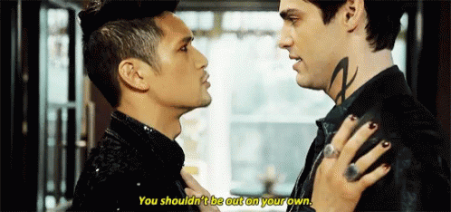 Two Men Looking at Each Other With Neck Tattoo