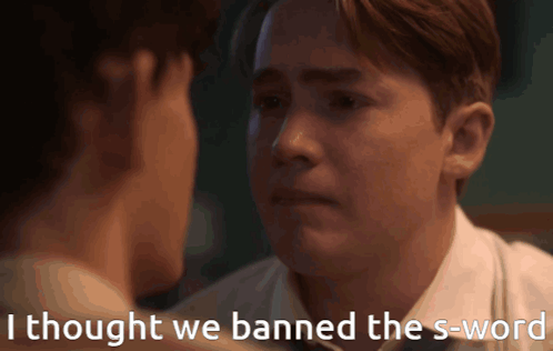 Two Men Looking At Each Other With The Words " I Thought We Banned The S-Word " On The Bottom GIF