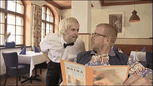 Two Men Looking at Plaza Mocha Menu