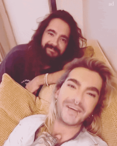 Two Men Lying On Couch GIF