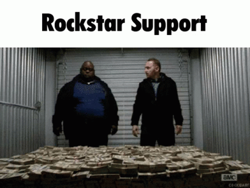 Two Men Next to Pile of Money Saying Rockstar Support