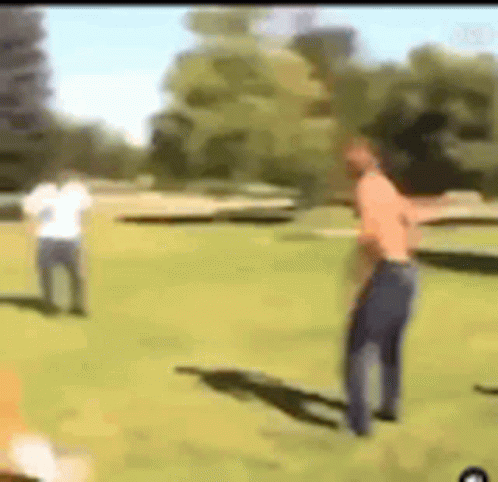 Two Men on a Grass Field