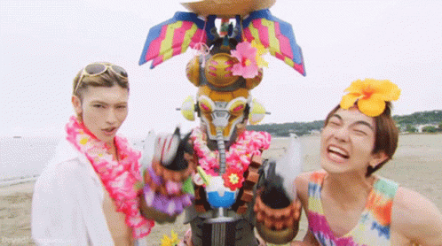Two Men on Beach One Wearing Lei