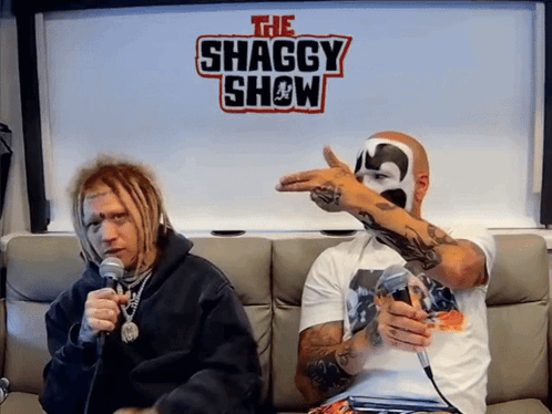 Two Men On Couch In Front Of Shaggy Show Sign GIF
