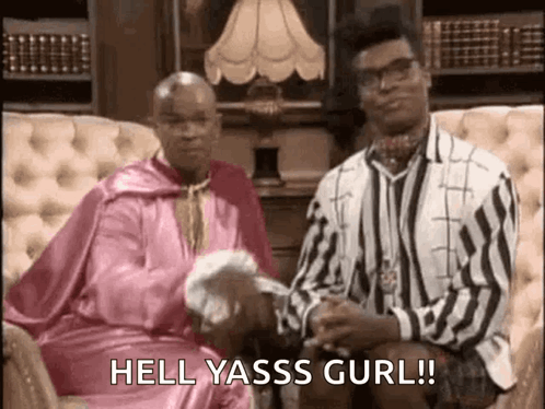 Two Men On Couch One In Pink Robe Holding Napkin GIF