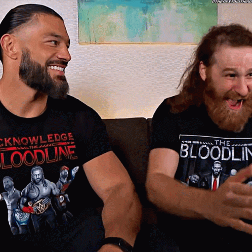Two Men on Couch, Shirt Says Knowledge Bloodline