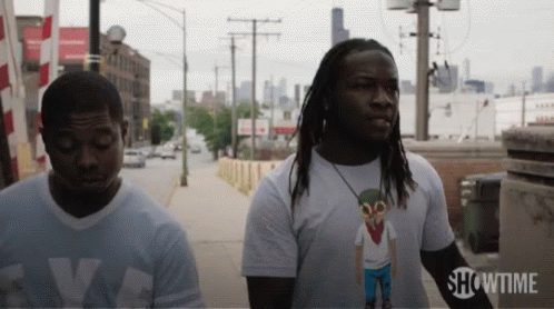 Two Men on Sidewalk with Showtime