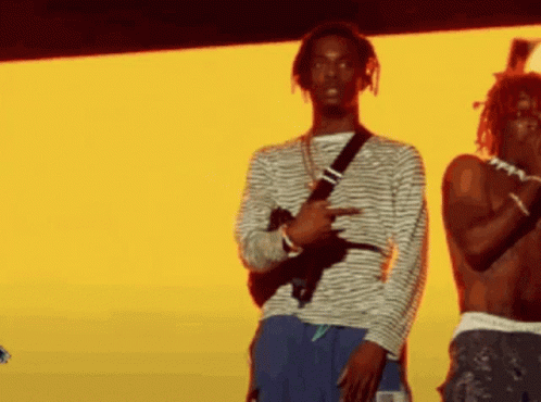 Two Men On Stage One Holding Gun GIF