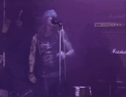 Two Men, One In Guns N' Roses Shirt GIF