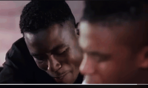 Two Men One Kissing Other on Forehead