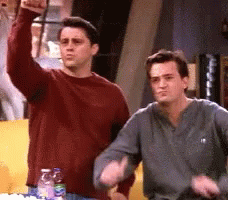 Two Men One Raising Fist