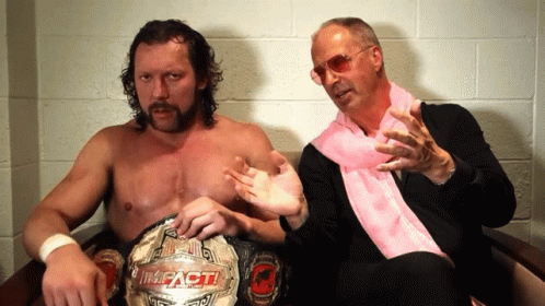 Two Men One Wearing Impact Championship Belt