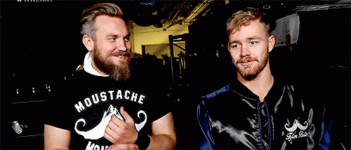Two Men One Wearing Moustache Shirt