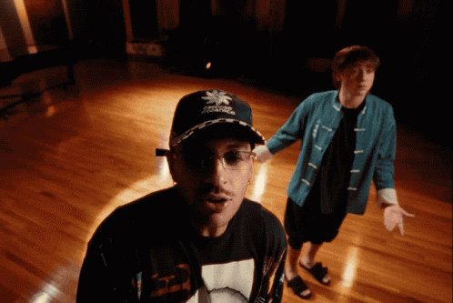 Two Men One With Reebok Hat