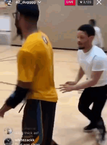 Two Men Playing Basketball Yellow and White Shirts