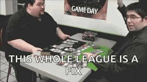 Two Men Playing Cards At Table GIF