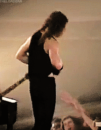 Two Men Playing Guitars, One in Psychokiller Tank Top