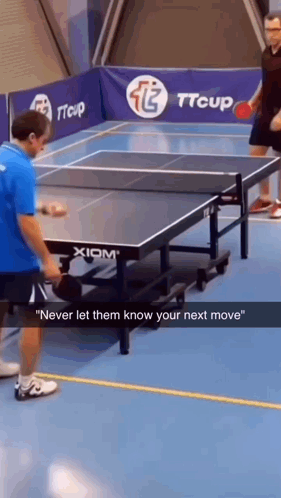 Two Men Playing Ping Pong