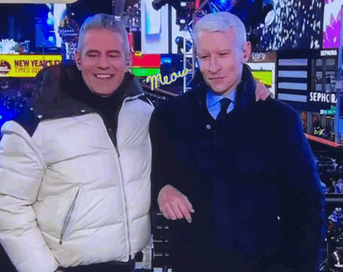 Two Men Posing in Front of Sephora Sign