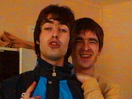 Two Men Posing One in Adidas Jacket