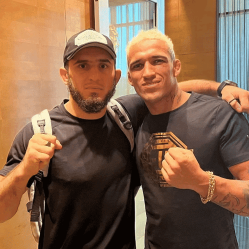 Two Men Posing One In UFC Shirt GIF