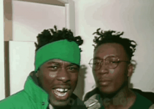 Two Men Posing One With Green Headband