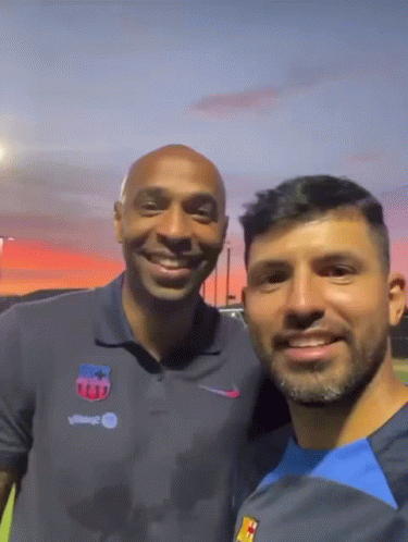 Two Men Posing One With Nike Logo