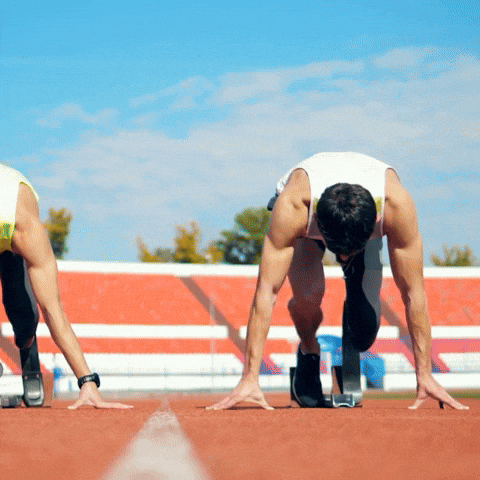 Two Men Preparing to Race on Track