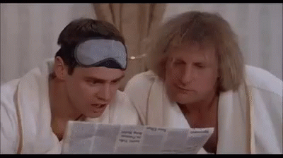 Two Men Reading Newspaper Wearing Sleep Masks GIF