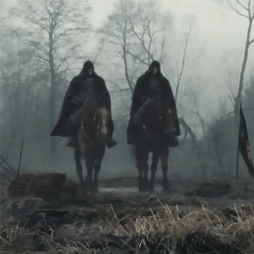 Two Men Riding Horses in Foggy Field
