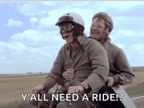 Two Men Riding Motorcycle One Asking Yall Need Ride