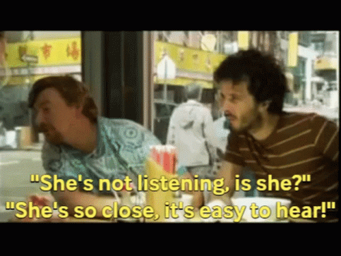 Two Men Saying She's Not Listening Is She